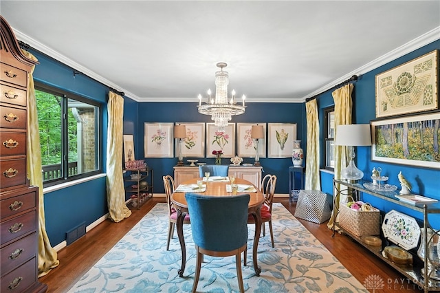 1314 Red Bud Trl, Dayton, OH 45409 - dining area featuring a chandelier, dark wood-style floors, and crown molding