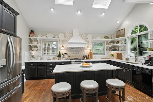 1314 Red Bud Trl, Dayton, OH 45409 - kitchen with appliances with stainless steel finishes, open shelves, custom exhaust hood, a skylight, and lofted ceiling