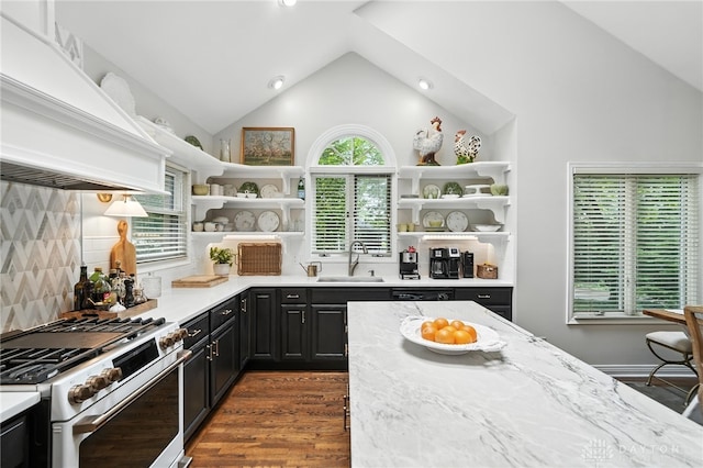 1314 Red Bud Trl, Dayton, OH 45409 - kitchen with open shelves, gas range, premium range hood, lofted ceiling, and tasteful backsplash