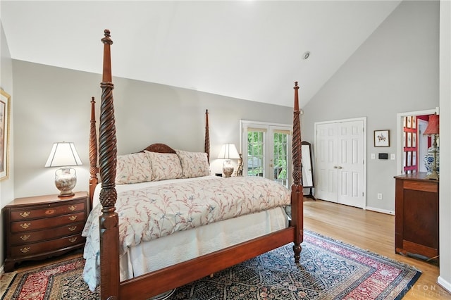 1314 Red Bud Trl, Dayton, OH 45409 - bedroom with wood finished floors, access to outside, and high vaulted ceiling
