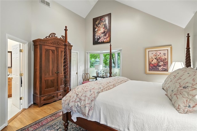 1314 Red Bud Trl, Dayton, OH 45409 - bedroom with high vaulted ceiling, light wood-type flooring, and ensuite bath