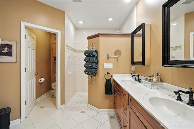 1314 Red Bud Trl, Dayton, OH 45409 - full bath featuring double vanity, walk in shower, tile patterned floors, and recessed lighting