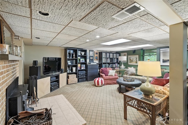 1314 Red Bud Trl, Dayton, OH 45409 - living room featuring carpet flooring and a fireplace