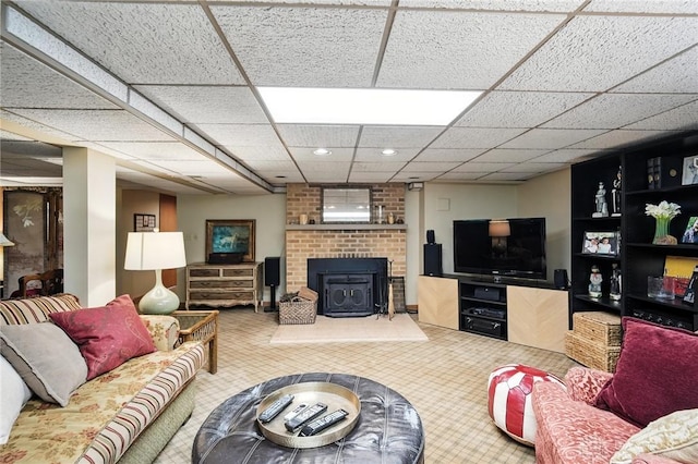 1314 Red Bud Trl, Dayton, OH 45409 - living room featuring carpet flooring, recessed lighting, a wood stove, and a drop ceiling