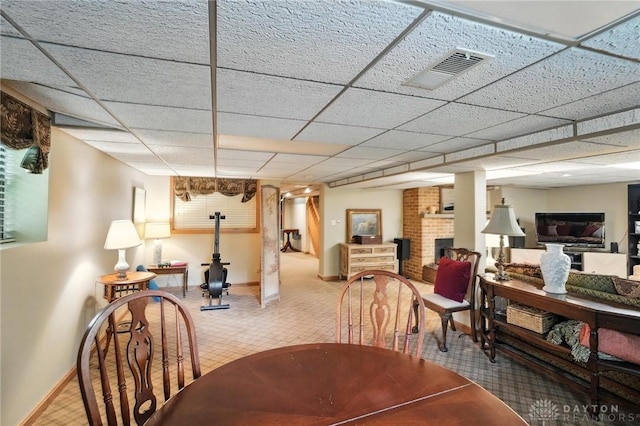 1314 Red Bud Trl, Dayton, OH 45409 - carpeted dining space with baseboards and a paneled ceiling