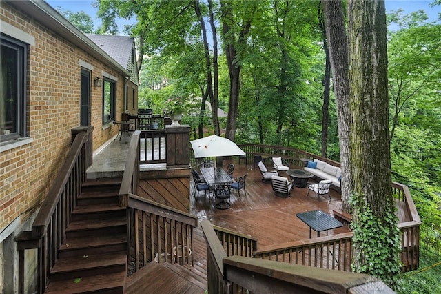 1314 Red Bud Trl, Dayton, OH 45409 - wooden terrace with an outdoor living space with a fire pit, outdoor dining area, and stairway