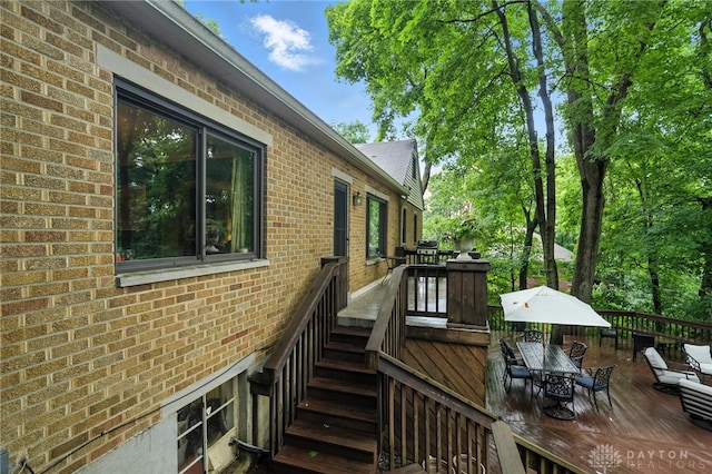 1314 Red Bud Trl, Dayton, OH 45409 - wooden deck with outdoor dining area and stairway