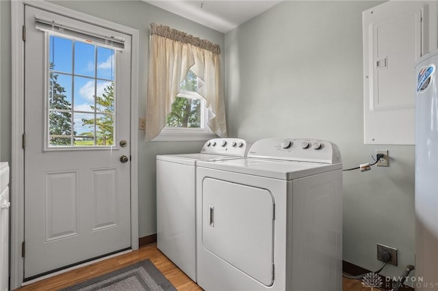 6977 Alternate State Route 49, Arcanum, OH 45304 - laundry area featuring plenty of natural light, washing machine and dryer, and light wood-style floors