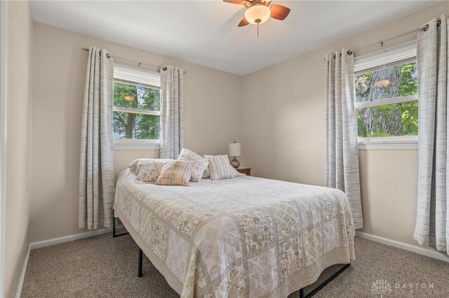 6977 Alternate State Route 49, Arcanum, OH 45304 - bedroom with carpet, multiple windows, and ceiling fan