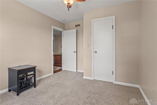 6977 Alternate State Route 49, Arcanum, OH 45304 - unfurnished bedroom featuring carpet and a ceiling fan