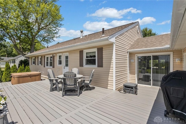 6977 Alternate State Route 49, Arcanum, OH 45304 - wooden deck featuring a covered hot tub, area for grilling, and outdoor dining area