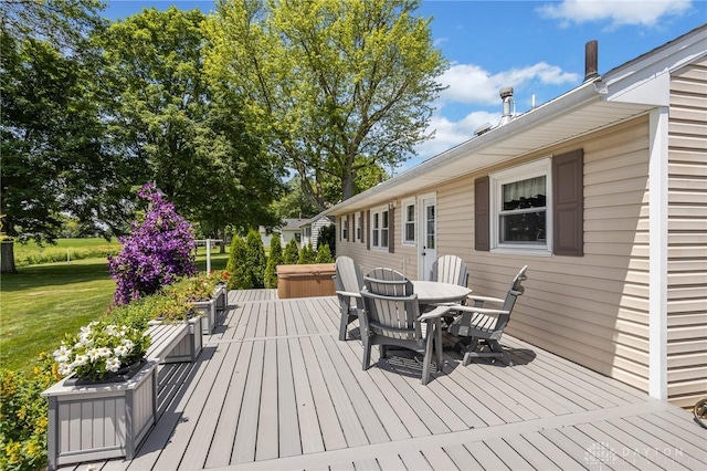 6977 Alternate State Route 49, Arcanum, OH 45304 - wooden deck featuring a hot tub, outdoor dining space, and a yard