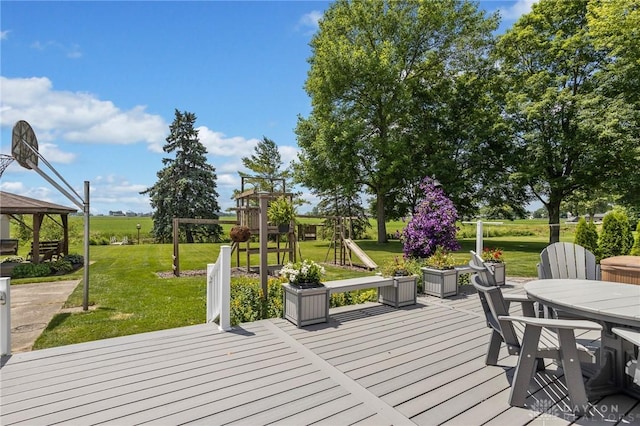 6977 Alternate State Route 49, Arcanum, OH 45304 - wooden deck with a gazebo, outdoor dining area, and a lawn