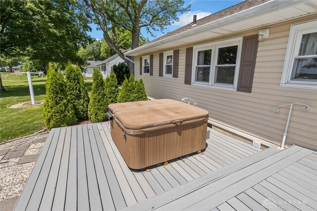 6977 Alternate State Route 49, Arcanum, OH 45304 - deck featuring a hot tub and a lawn