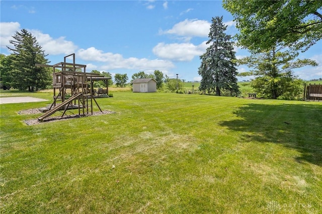 6977 Alternate State Route 49, Arcanum, OH 45304 - view of green lawn featuring a playground and a storage shed