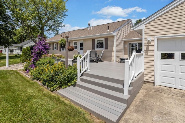 6977 Alternate State Route 49, Arcanum, OH 45304 - deck with a lawn and a garage