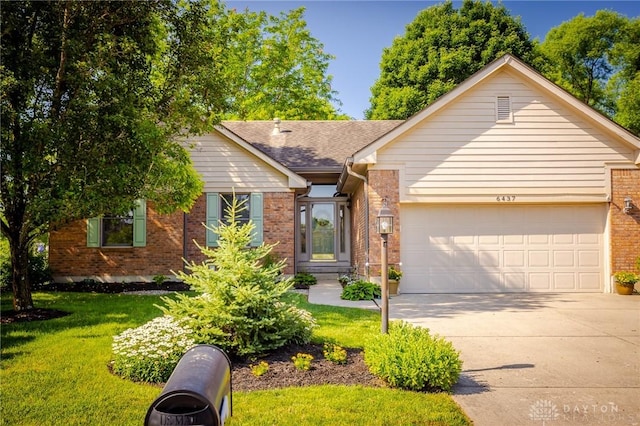 6437 Sun Ridge Dr, Waynesville, OH 45068 - single story home with brick siding, concrete driveway, a garage, a front lawn, and a shingled roof