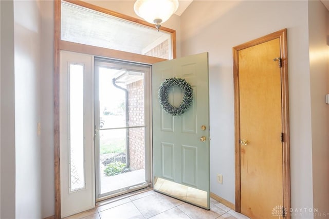 6437 Sun Ridge Dr, Waynesville, OH 45068 - foyer entrance with light tile patterned flooring and baseboards