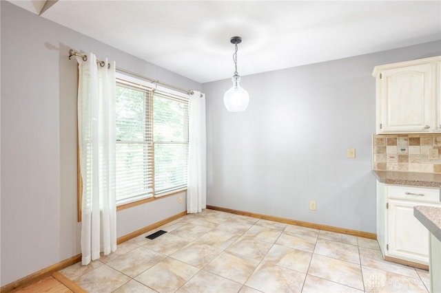 6437 Sun Ridge Dr, Waynesville, OH 45068 - unfurnished dining area featuring baseboards