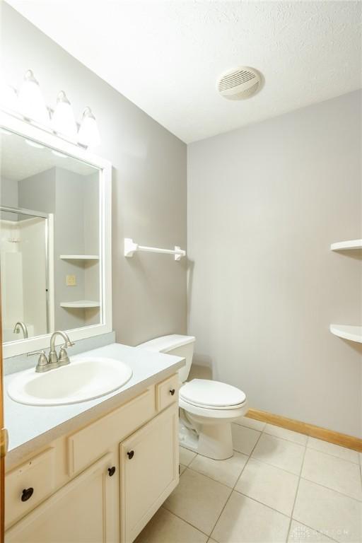 6437 Sun Ridge Dr, Waynesville, OH 45068 - bathroom with tile patterned floors, vanity, and a shower