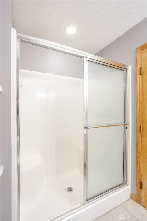 6437 Sun Ridge Dr, Waynesville, OH 45068 - bathroom with tile patterned flooring, a stall shower, and recessed lighting