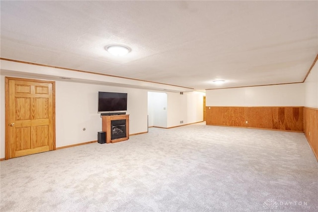 6437 Sun Ridge Dr, Waynesville, OH 45068 - finished below grade area with a fireplace, carpet floors, wooden walls, and wainscoting