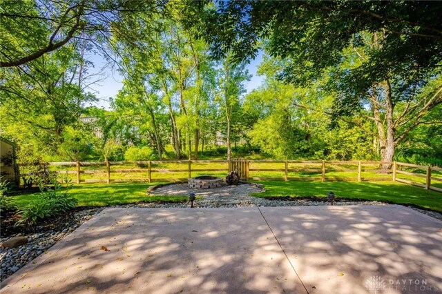 6437 Sun Ridge Dr, Waynesville, OH 45068 - view of patio featuring a fire pit