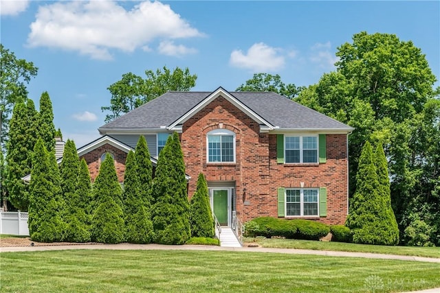 2384 Flyway Ct, Beavercreek, OH 45431 - colonial inspired home with brick siding, a front lawn, and a chimney
