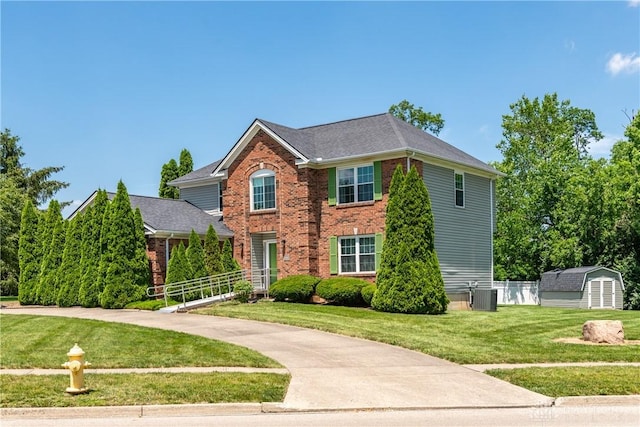 2384 Flyway Ct, Beavercreek, OH 45431 - traditional-style house with brick siding and a storage shed