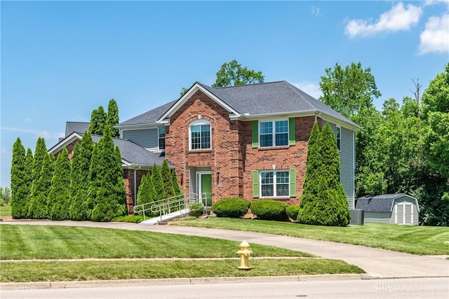 2384 Flyway Ct, Beavercreek, OH 45431 - view of front of home featuring brick siding, a front lawn, and roof with shingles