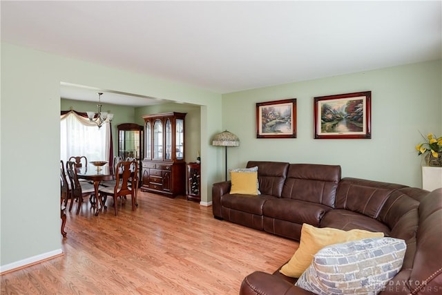 2384 Flyway Ct, Beavercreek, OH 45431 - living room featuring a chandelier and light wood-style floors