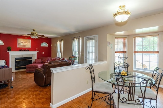 2384 Flyway Ct, Beavercreek, OH 45431 - dining room featuring plenty of natural light, ceiling fan, and a fireplace