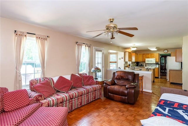 2384 Flyway Ct, Beavercreek, OH 45431 - living room featuring healthy amount of natural light and a ceiling fan