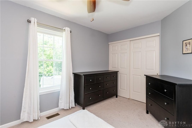 2384 Flyway Ct, Beavercreek, OH 45431 - bedroom with light carpet, multiple windows, and a closet