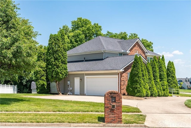 2384 Flyway Ct, Beavercreek, OH 45431 - traditional-style house with driveway, a shingled roof, brick siding, and an attached garage