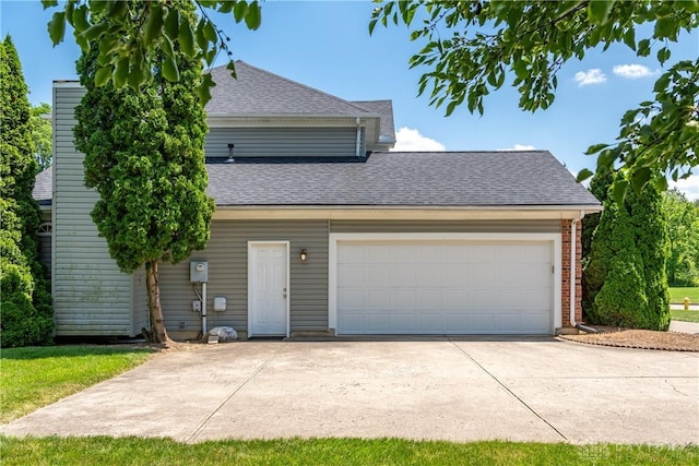 2384 Flyway Ct, Beavercreek, OH 45431 - view of front of house featuring a shingled roof, concrete driveway, and an attached garage