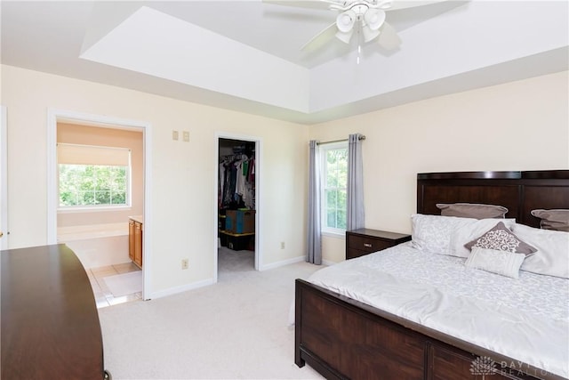 2384 Flyway Ct, Beavercreek, OH 45431 - bedroom with light carpet, multiple windows, a spacious closet, and a closet