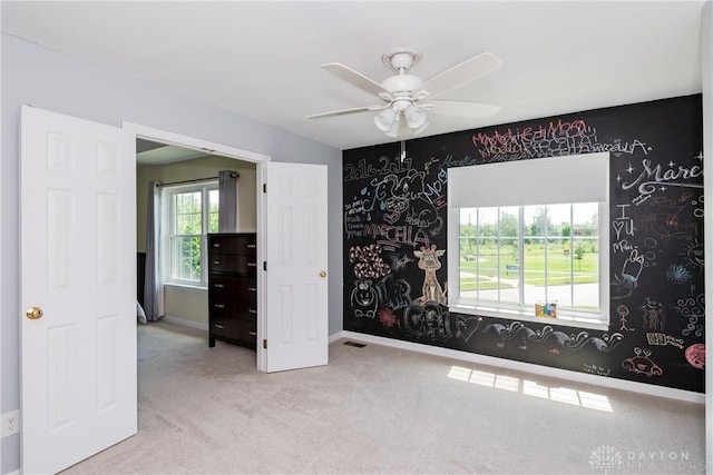 2384 Flyway Ct, Beavercreek, OH 45431 - carpeted spare room with wallpapered walls and a ceiling fan