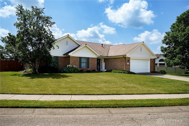 6426 Anvil Dr, Waynesville, OH 45068 - view of front facade with brick siding, a garage, and concrete driveway