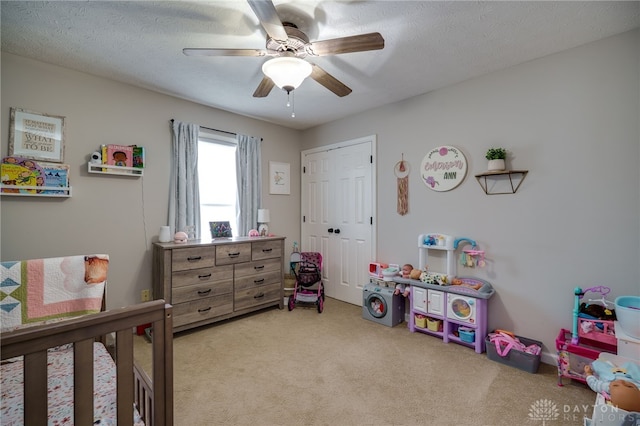 6426 Anvil Dr, Waynesville, OH 45068 - carpeted bedroom with a closet, ceiling fan, and a textured ceiling