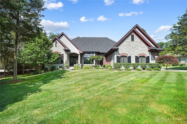 7921 Locust Grove Ct, Springboro, OH 45066 - french country inspired facade featuring stone siding and a front lawn