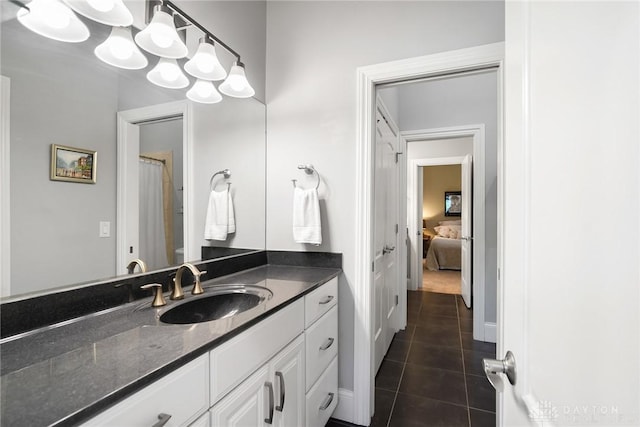 7921 Locust Grove Ct, Springboro, OH 45066 - full bath featuring vanity, tile patterned flooring, and ensuite bath