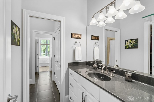 7921 Locust Grove Ct, Springboro, OH 45066 - ensuite bathroom featuring vanity and tile patterned floors