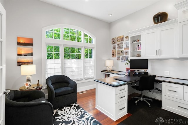 7921 Locust Grove Ct, Springboro, OH 45066 - office area featuring built in study area and dark wood-style flooring
