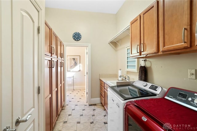 7921 Locust Grove Ct, Springboro, OH 45066 - laundry area with washer and clothes dryer and cabinet space
