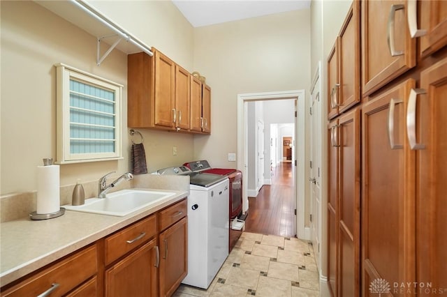 7921 Locust Grove Ct, Springboro, OH 45066 - laundry area with washer and clothes dryer, cabinet space, and light tile patterned floors