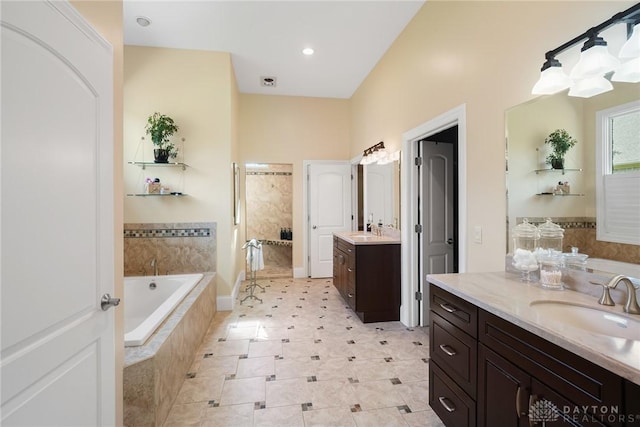 7921 Locust Grove Ct, Springboro, OH 45066 - full bath featuring two vanities, a bath, and recessed lighting