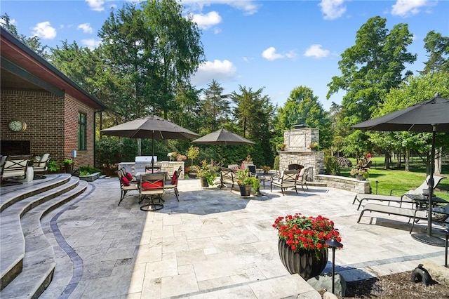 7921 Locust Grove Ct, Springboro, OH 45066 - view of patio / terrace with an outdoor stone fireplace, outdoor dining area, and area for grilling