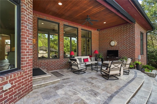 7921 Locust Grove Ct, Springboro, OH 45066 - view of patio with a ceiling fan and an outdoor living space with a fireplace