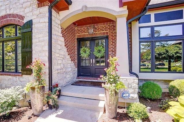 7921 Locust Grove Ct, Springboro, OH 45066 - property entrance featuring french doors and stone siding